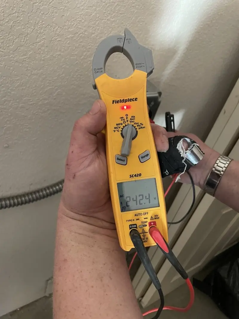 Voltage testing with clamp meter during Outlet Installation in North Alamo